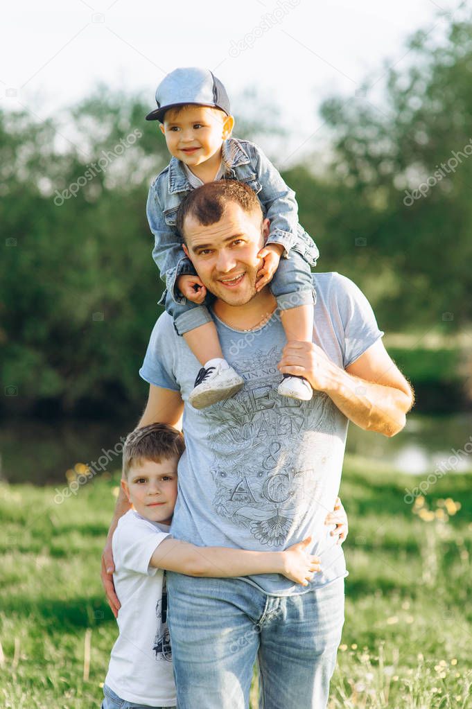 family father and two sons spending time outdoors