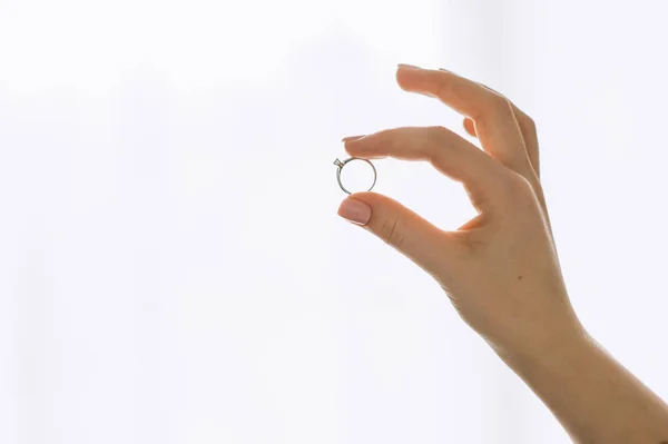 Show ring on finger isolated on white background