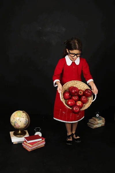 Beautiful Schoolgirl Red Dress Books Apples Globe Black Background — Stock Photo, Image
