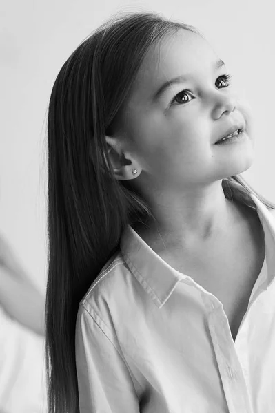 A portrait of beautiful little girl in the morning bedroom — Stock Photo, Image