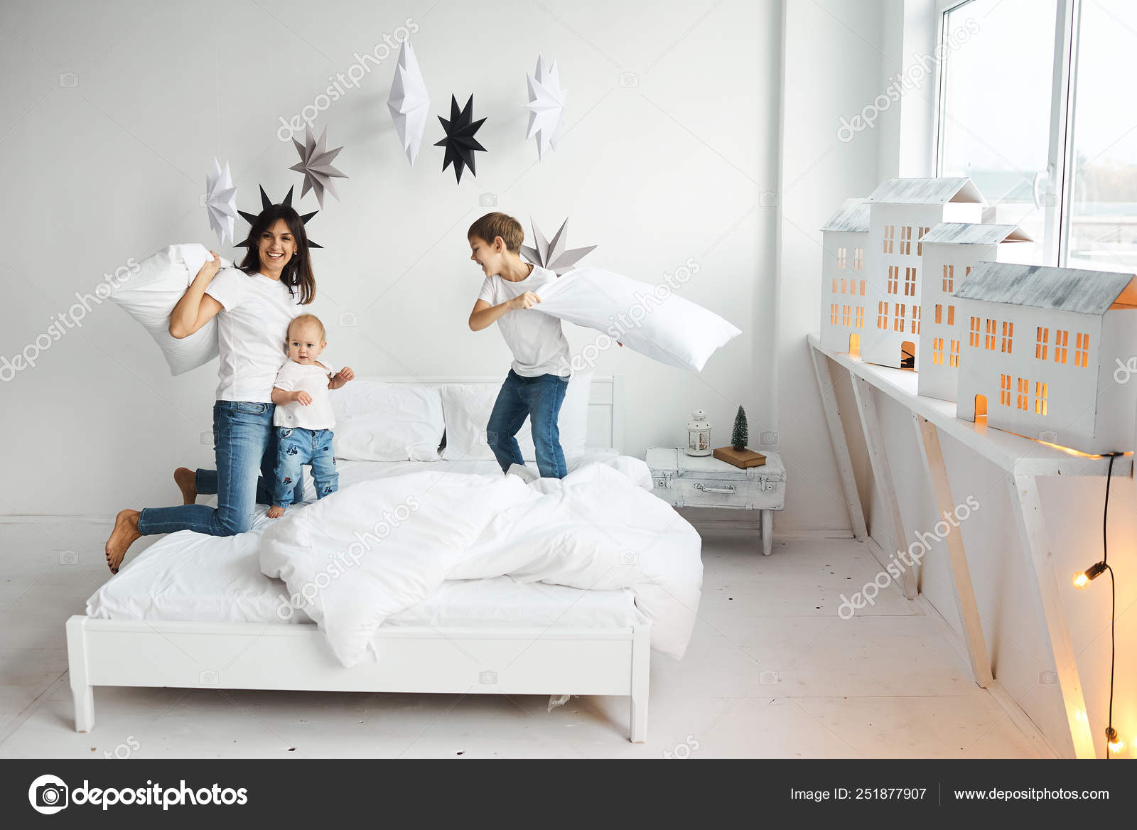 Happy Loving Family Mother Playing With Her Children In The