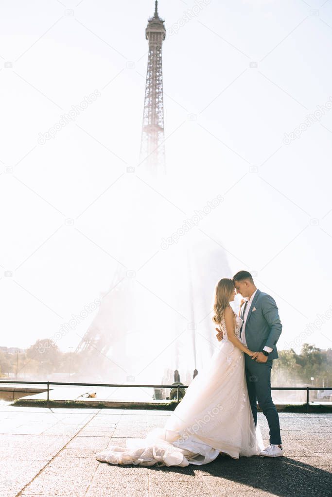 Happy bride and groom enjoying their wedding in Paris