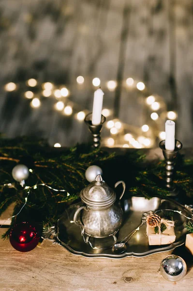 Christmas decoration on wooden table. Candles, Christmas tree br — Stock Photo, Image