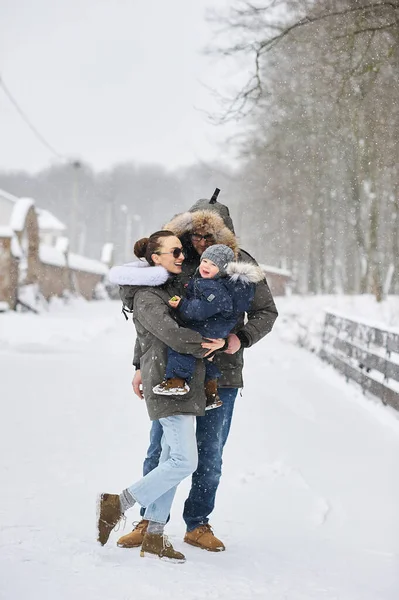 Happy family have a fun outside near the house in winter — Stock Photo, Image