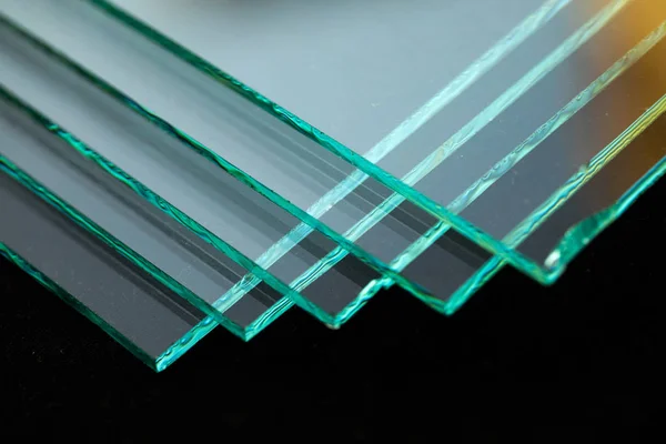 Sheets of Factory manufacturing tempered clear float glass panels cut to size.