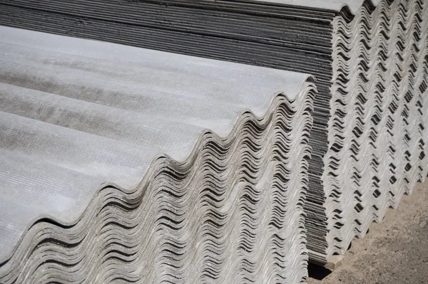 Pack sheets of asbestos slate. Building material for roofing