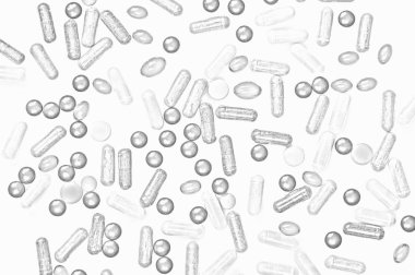 Terapötik kapsüllerin dokusu bir ışık üzerine dağılmış
