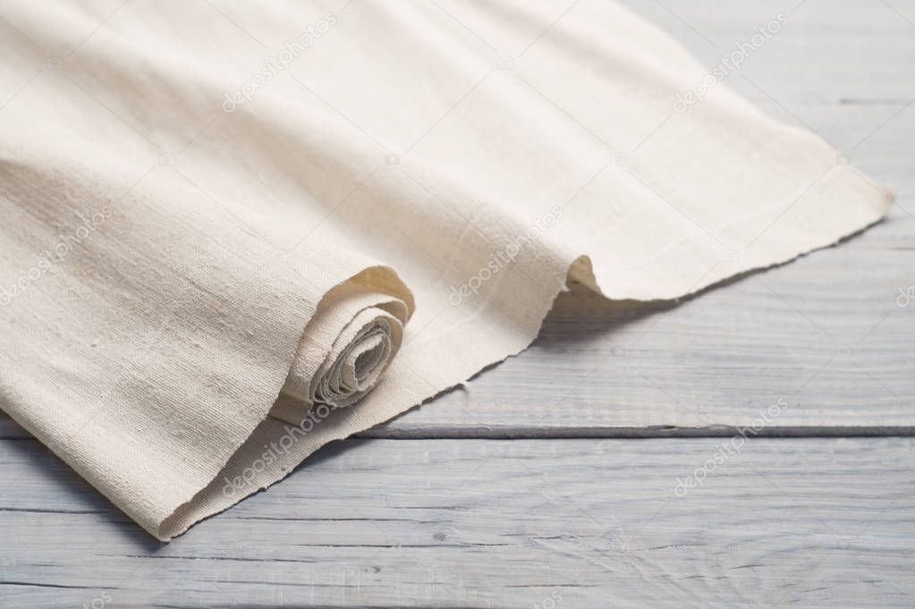 Hemp fabric on a white wooden surface