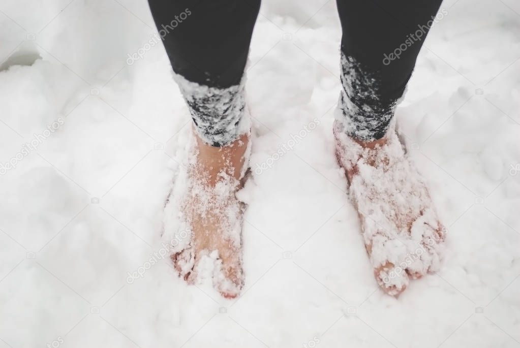Men's bare feet in the snow