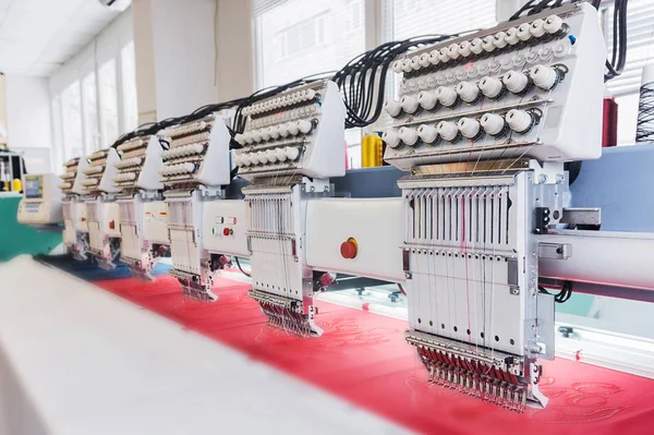 Industrial embroidery machine in textile factory