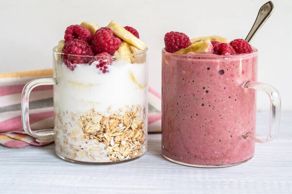 Banana, raspberry, oatmeal and yogurt smoothies and ingredients 