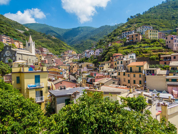 Beautiful panoramic summer view of Riomaggiore, one of the five villages of Cinque Terre in Liguria, north Italy. UNESCO World Heritage Site