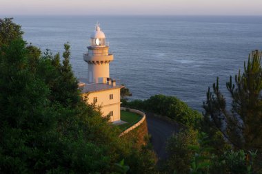 The Igueldo Lighthouse in San Sebastian city, Basque Country, Spain. Photographed at sunrise. clipart
