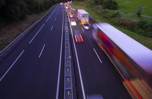 Lorry trucks and cars in traffic jam on the highway at sunset, Basque Country