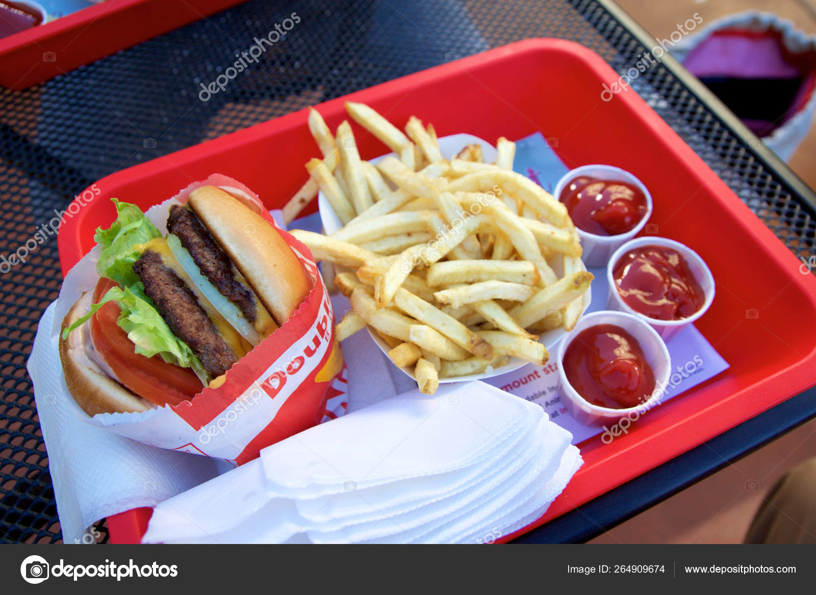 SAN FRANCISCO, CALIFORNIA, UNITED STATES - NOV 25th, 2018: In n Out Double  Double cheeseburger with animal style, burger with protein style, and  french fries in a tray – Stock Editorial Photo © miles_around #264909674