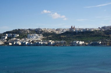MELLIEHA, MALTA - JAN 01st, 2020: Aerial view of Mellieha city with ocean