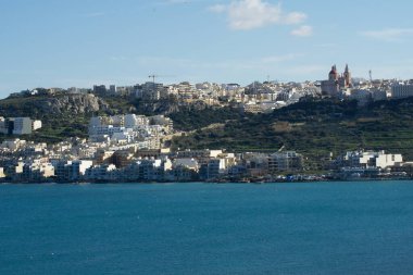 MELLIEHA, MALTA - JAN 01st, 2020: Aerial view of Mellieha city with ocean