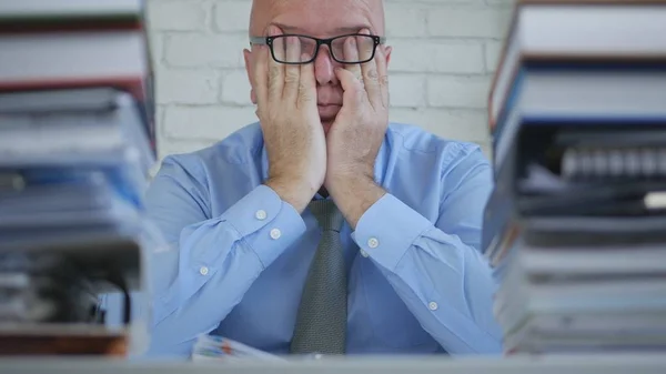 Tired Businessman With Eyeglasses Working Late In Accounting Office