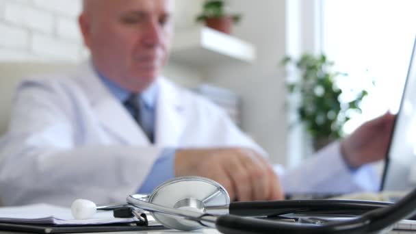 Doctor Start Working Put His Stethoscope Opening Laptop Blurred Image — Stock Video