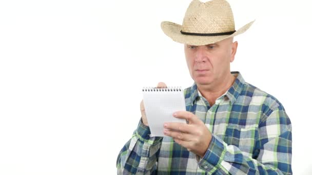 Image Serious Preoccupied Farmer Taking Notes Using Small Pocketbook — Stock Video