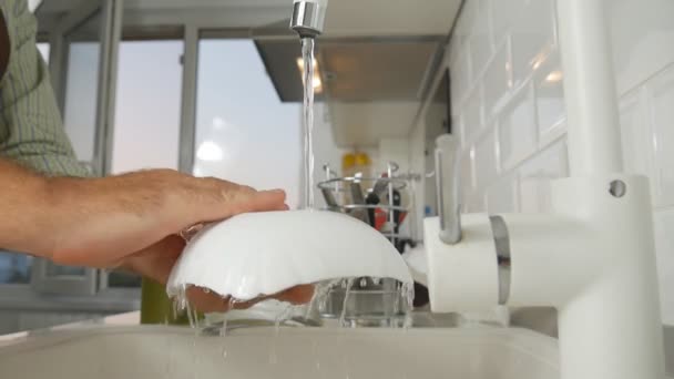 Slow Motion Man Washes the Dishes in the Kitchen Sink — Stock Video