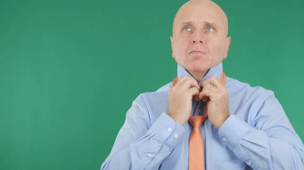 Green Background With Businessman Dress Arranging His Shirt and Tie — Stock Photo, Image