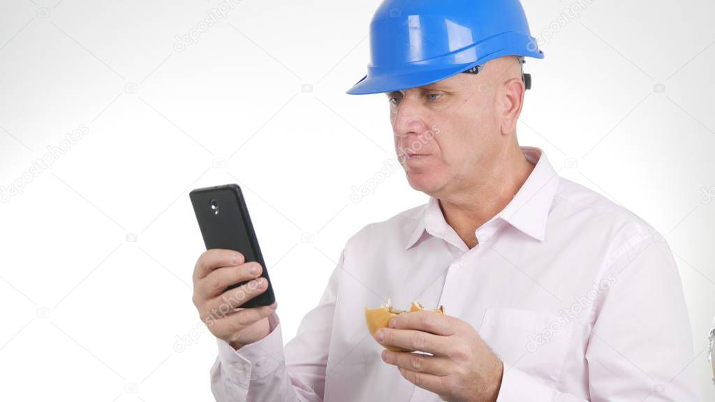 Engineer Image Eat a Sandwich and Text Using Cellphone