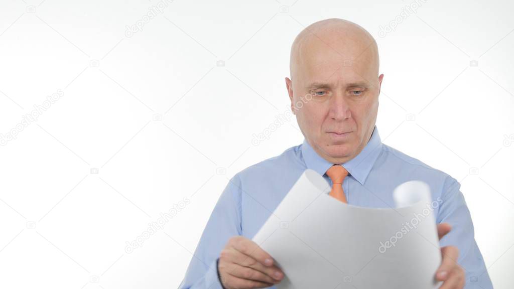 Businessman Opening and Reading a Building Project