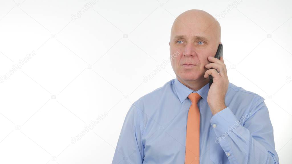 Confident Businessman Talking Business to Cellphone