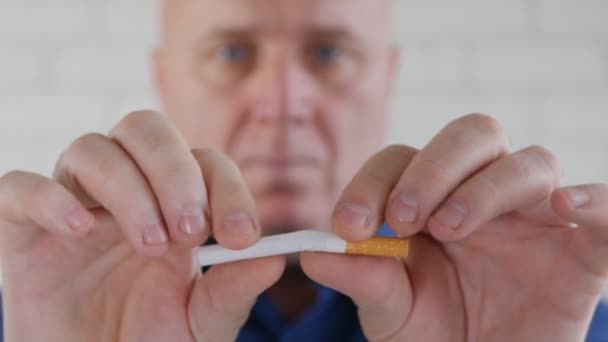Man Presenting Tobacco Campaign Showing Breaking Cigarette Hands — Stock Video