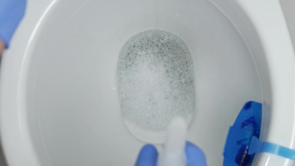 Man Clean Toilet Seat Using Disinfecting Spray Antibacterial Solution — Stock Video