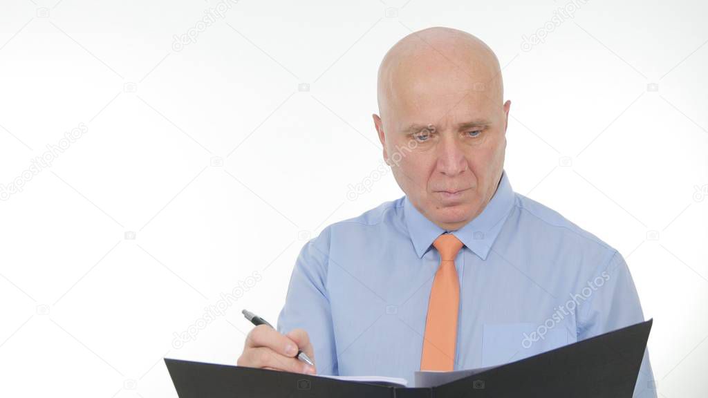 Businessman Image Reading and Writing Business Documents from a Black Folder
