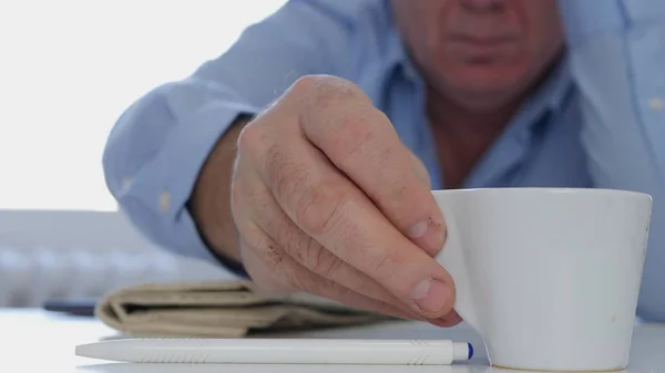 Relaxed Businessman in Working Pause Drinking a Fresh and Tasty Hot Coffee