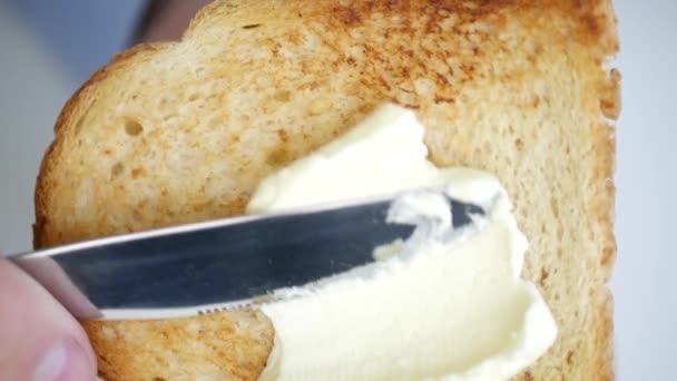 Man Use Knife and Spread White Butter on a Roasted Slice of Bread in Slow Motion — Stock Video