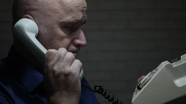Tired and Upset Man Make a Phone Call Using an Old Telephone
