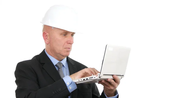 Image with Busy Engineer Using Laptop Communication Stock Photo