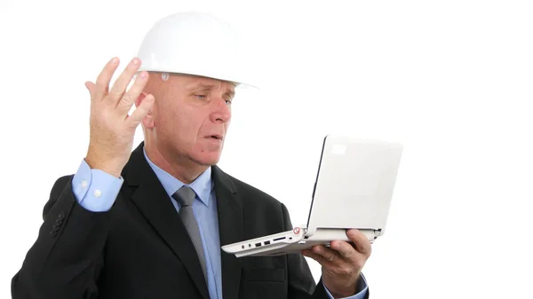 Image with Busy Engineer Using Laptop Communication Stock Photo