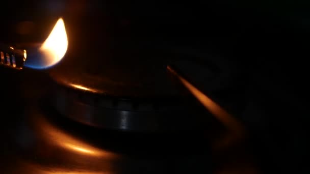 Man Open the Fire on Kitchen Stove Using Electric Light — Stock Video