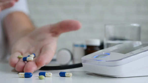 Man in Hospital Take Medicines After Checking His Blood Pressure