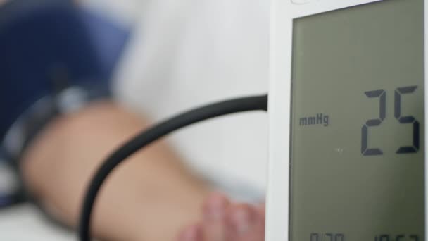 Suffering Person in a Hospital Checking the Blood Pressure — Stock Video