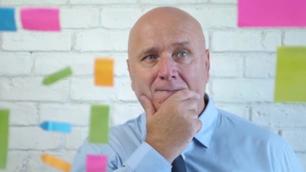 Businessman in Conference Room Before a Meeting Check Notes from the Glass Panel — Stock Video