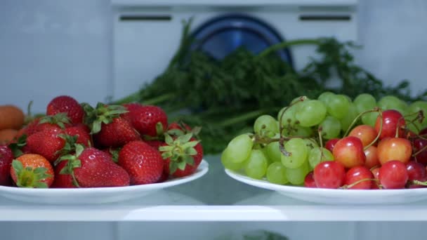 Shooting with Fresh and Cold Strawberries, Cherries and Grapes in a Kitchen Refrigerator — Stock Video