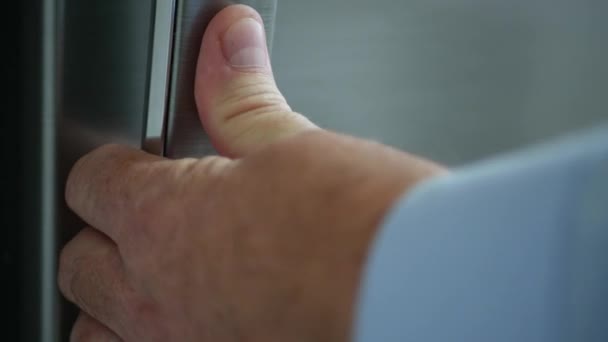 Blurred Image of a Man Opening the Door of a Refrigerator Full of Food and Taking a Bottle of Cold Orange Juice — Stock Video