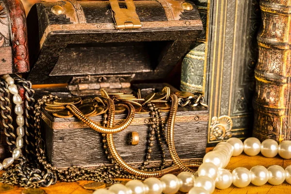 Treasure chests with gold. Pearls and gold chains. Vintage style