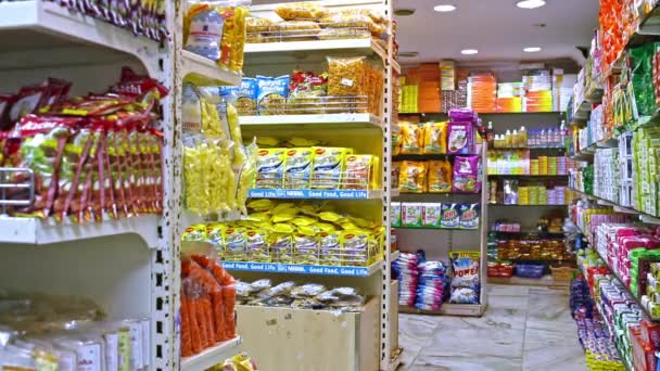 CHENNAI, INDIA - APRIL 05, 2019: Many cookies and candies on the shelf in the supermarket. — Stock Video