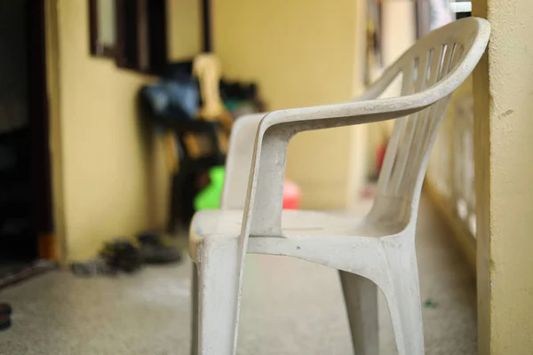 White plastic chair in front of the house — ストック写真