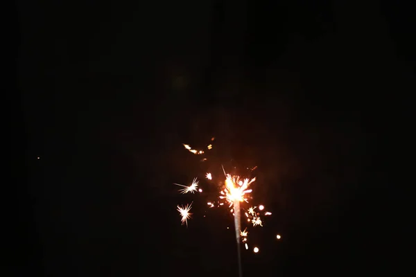 Hand Holding Burning Sparkler Blast On A Black Background — ストック写真