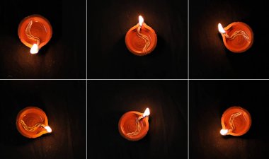 Diwali Festivali kutlamaları için siyah zemin üzerinde gaz lambası.