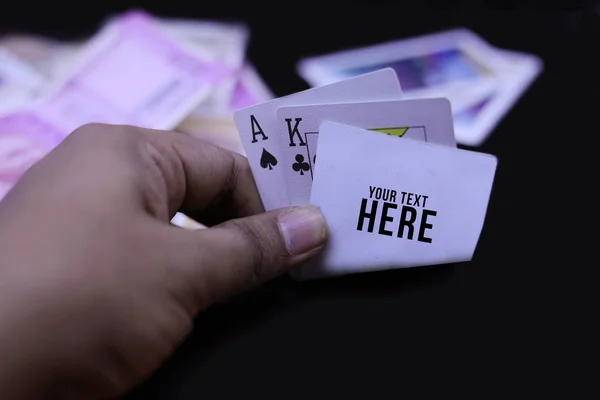 Hand holds a combination in poker - three of a kind on a black b — Stock Photo, Image