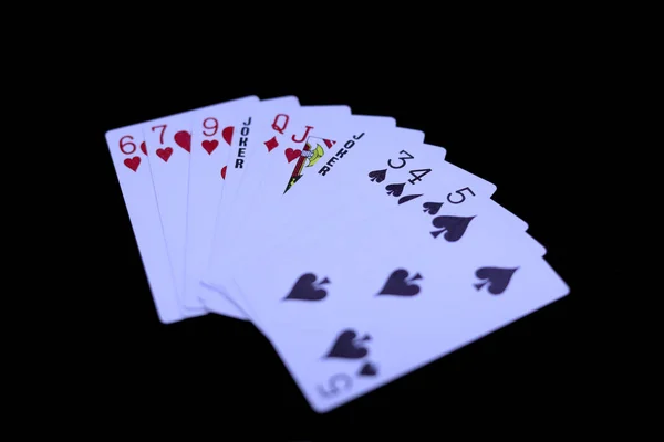 Jogando cartas isoladas em um fundo preto , — Fotografia de Stock